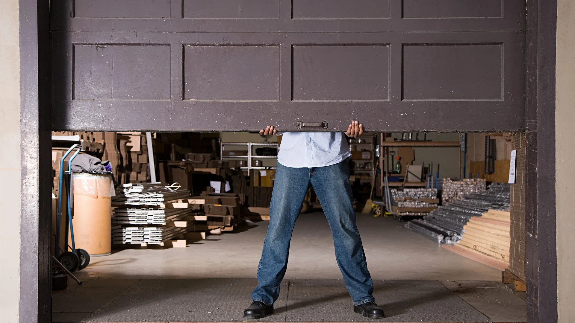 Person manually opening garage door