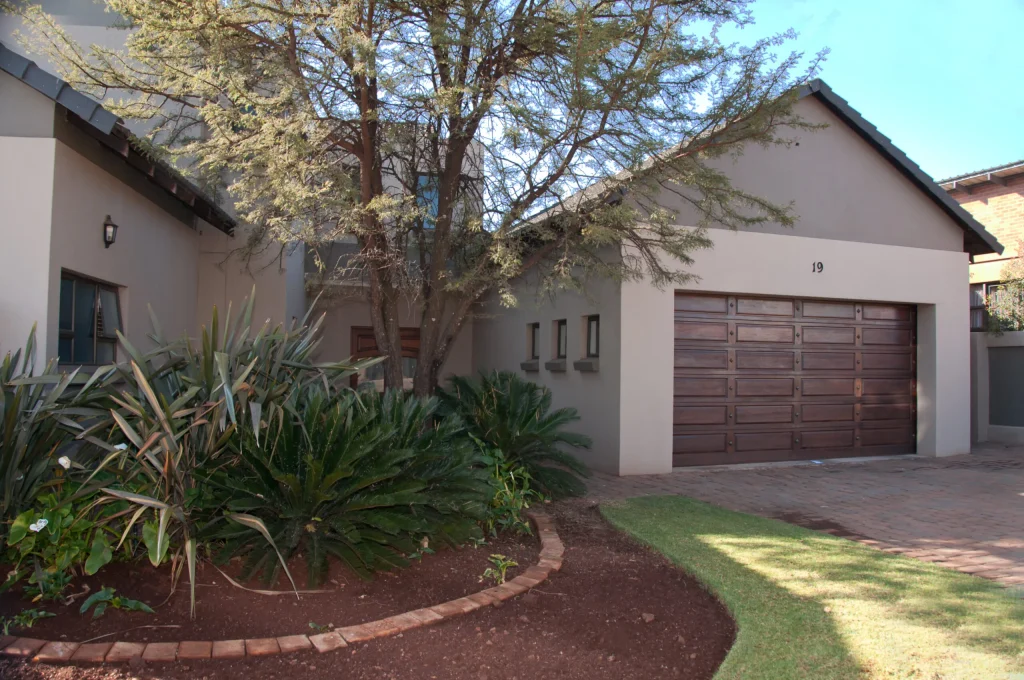 House with wooden garage door