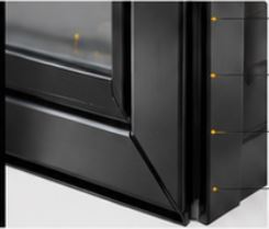 Corner detail of a Roos framed aluminium garage door showing the frame profile, joint and powder coated finish