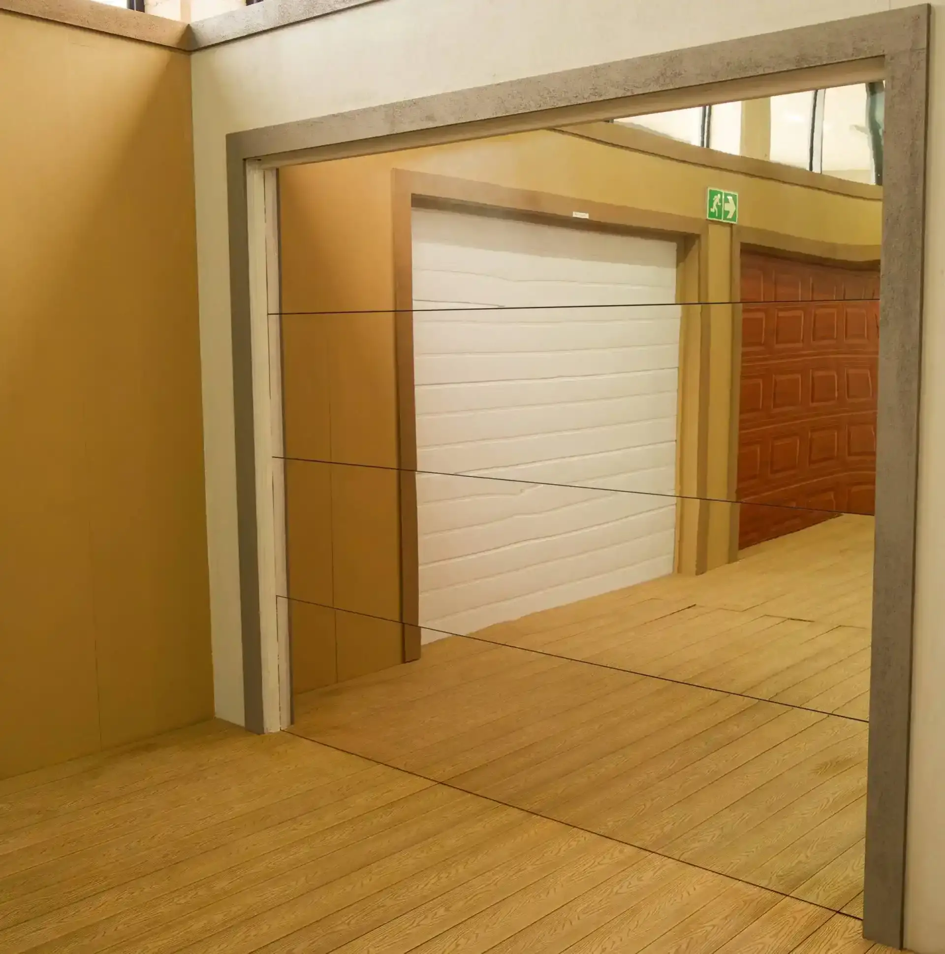 Grey and white house with grey wooden double garage door